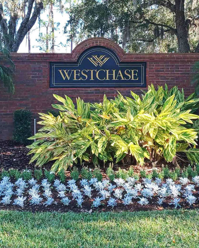 Westchase wall sign with flowerbed