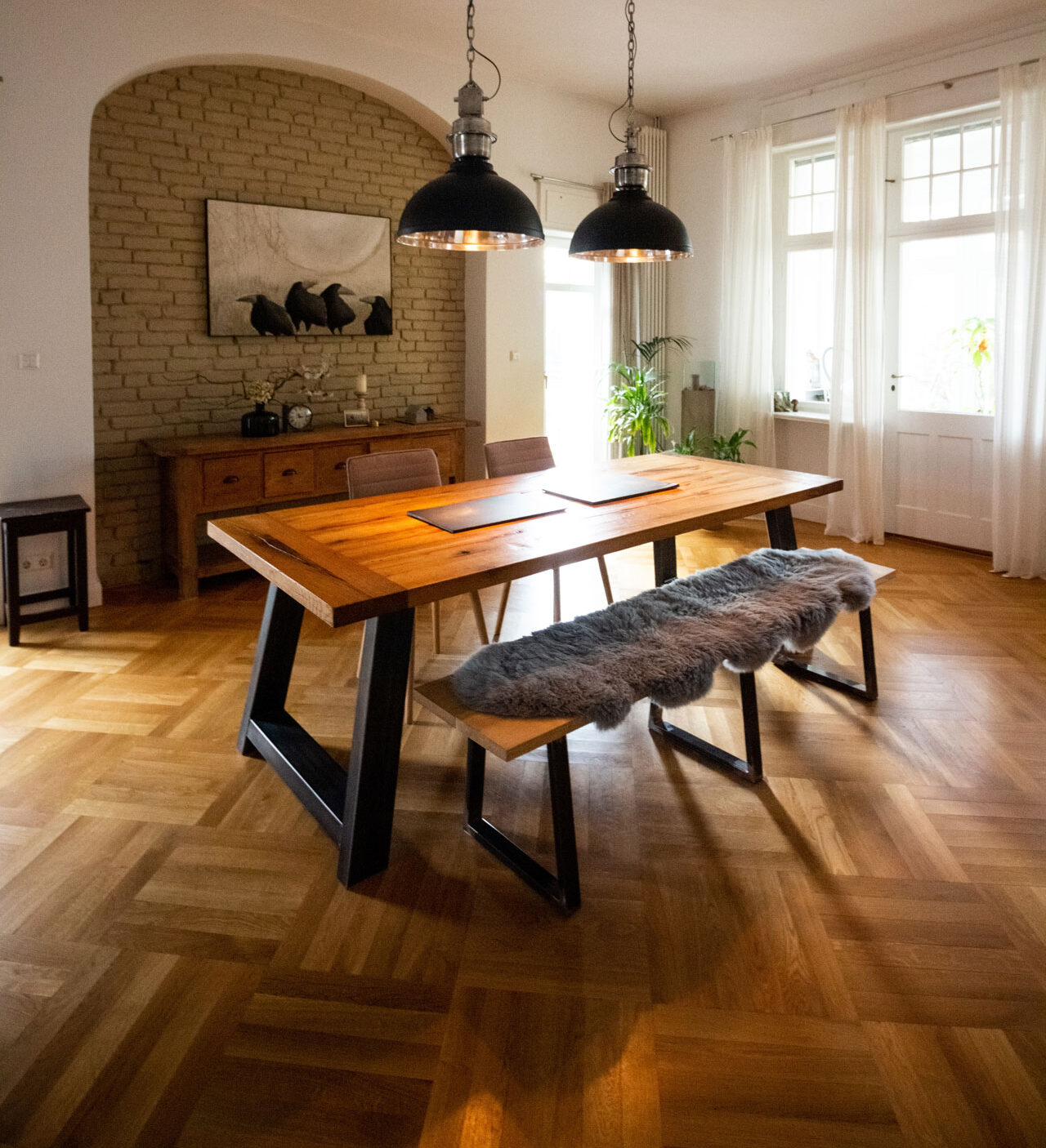 Wood floors with herringbone pattern in dining room