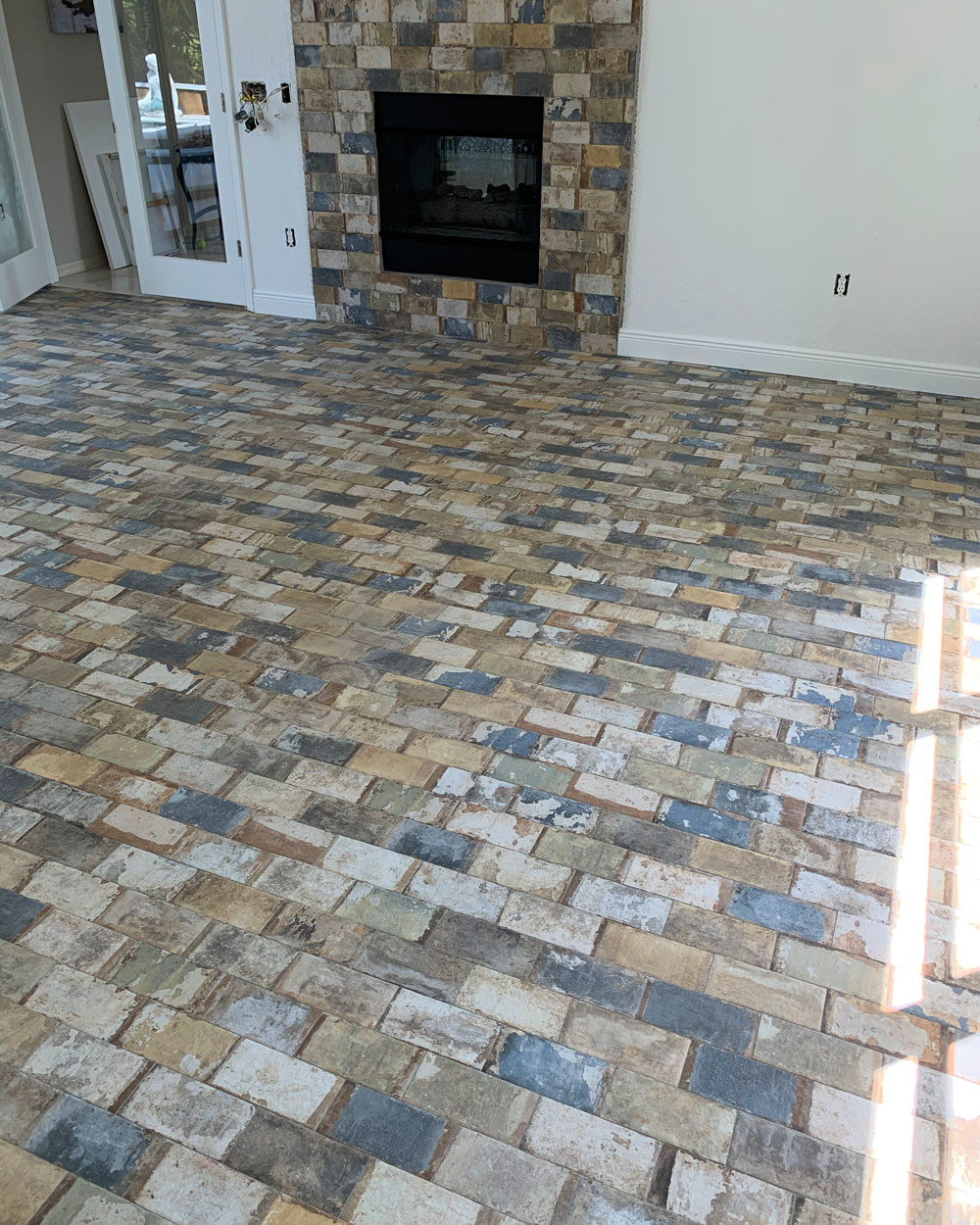 Patio with tile floors with brick pattern