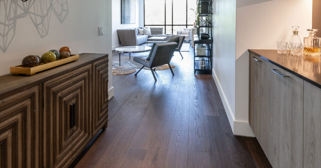 Hallway with dark brown hardwood flooring