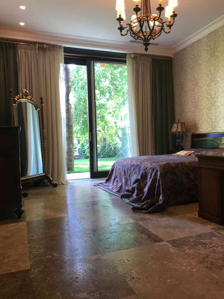 Bedroom with large brown tiles